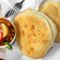 Cholle Bhature (1 Pieces) · Vegan. Fluffy, deep fried all purpose flour bread Served with chickpea curry house pickle.