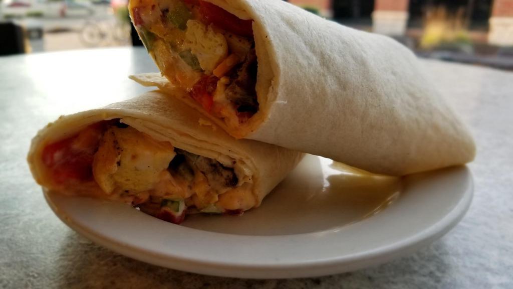 Southwest Sausage Breakfast Wrap · A savory combination that is bursting with flavor! Egg, sausage, cheddar, green peppers, roasted red peppers, onion and chipotle aoili.