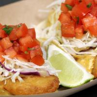 Fish · Beer-battered cod, baja sauce and vinaigrette cabbage slaw topped with pico de gallo.