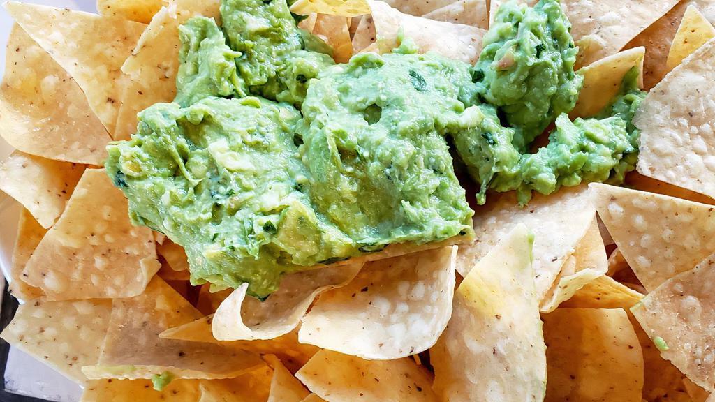 Chips & Gaucamole  · Handcrafted  guacamole coarsely mashed with  red onions, lime juice, garlic, cilantro  served with locally source tortilla chips.
