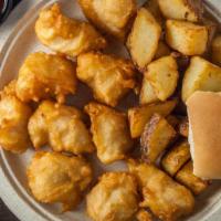 Chicken Bites Dinner · Approximately 10 battered dipped chicken bites cooked to a golden brown, served with one sid...