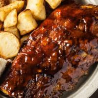 Rib Dinner · 8 bones of our tender fall off the bone baby back ribs brushed with our signature BBQ sauce ...