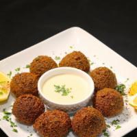 Falafel · Ground chickpeas with parsley and onions. Served with tahini. Vegetarian.