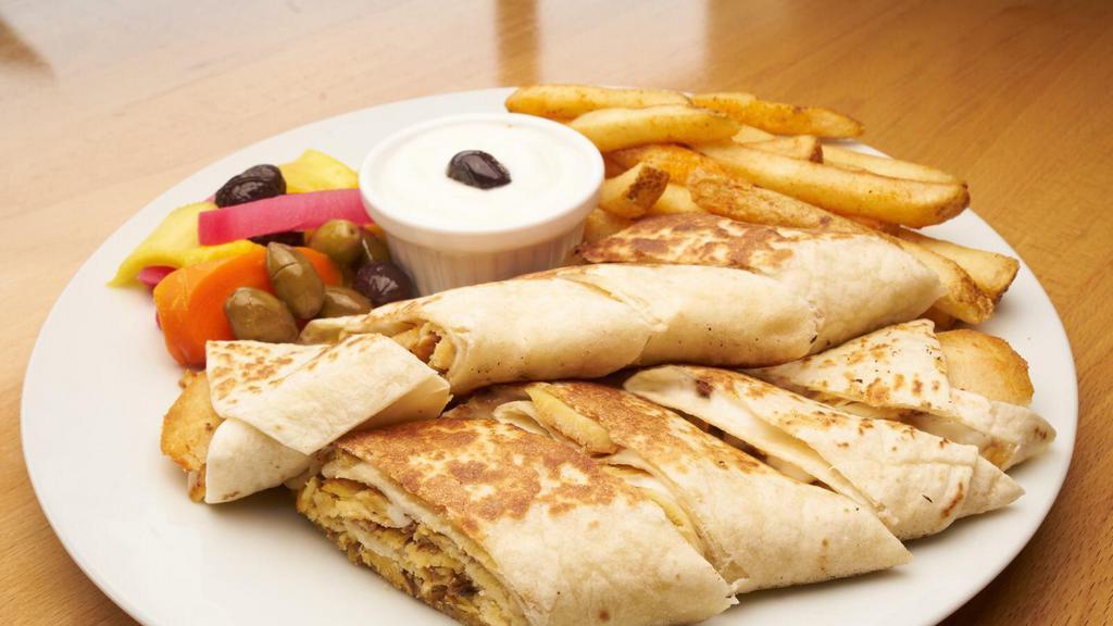 Special Grilled Shawarma · Thin sliced chicken pieces served with fries, pickles and garlic sauce.