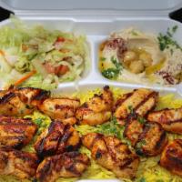Chicken Kabob Plate · 2 skewers of grilled chicken Kabob marinated for a perfect taste served with rice, salad, pi...