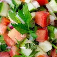 Jerusalem Salad Large · Diced Tomatoes, Cucumber, Tahini Sauce, Parsley. & Lemon
