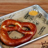Fresh Baked Pretzel · This large, fresh-baked pretzel is glazed with butter and salt. Served with homemade cheese ...