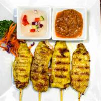 Chicken Satay · Marinated chicken grilled and served with peanut sauce and cucumber salad sauce.