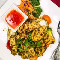 Grilled Chicken (Thai Style) · Grilled marinated boneless chicken with homemade garlic sauce in the bed of mixed vegetable ...