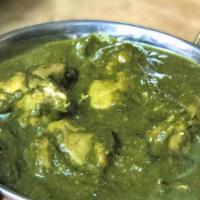 Chicken Saag · Chicken cooked with spinach and spices.