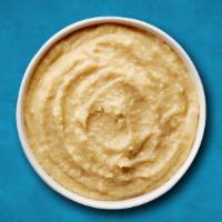 Hearty Hummus · A smooth thick mixture of mashed chickpeas, tahini, oil, lemon juice, and garlic. Served wit...