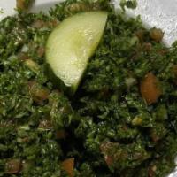 Lebanese Tabouli Salad · Tomatoes, green onion, chopped parsley, lemon, olive oil and cracked wheat with unique dress...