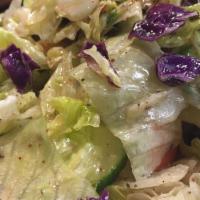 Cabbage Salad · Chopped cabbage, onion, tomatoes, cucumber, parsley, home dressing.