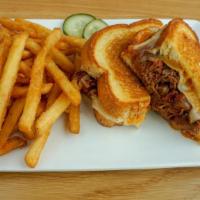 Brisket Grilled Cheese · Aged cheddar and provolone, smoked brisket, and sauteéd onions