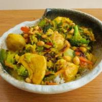 Thai Curry Bowl · Creamy yellow curry with kale, carrots, bell peppers, brussels sprouts, cilantro, basil, and...