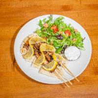 Chicken Skewers · Marinated skewers (three) served with pita and mixed green salad.