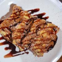 Greek French Toast · Our French toast soaked in mastiha batter and topped with cocoa bitter and salted caramel sa...