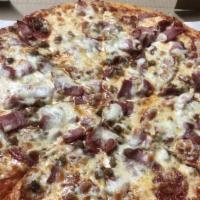 Meat Pie · Pepperoni, sausage, ham, ground beef, bacon, and Mozzarella cheese.