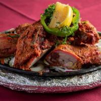 Chicken Tandoori · Chicken marinated in yogurt blended with ginger garlic paste and Indian spice mix.