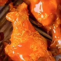 Hot Wings · Traditional bone-in chicken wings tossed in classic Buffalo Sauce.