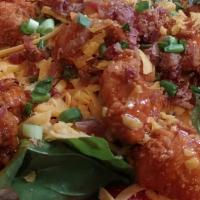 Buffalo Chicken Salad · Fried Chicken tossed in zesty Buffalo sauce. With bacon, tomato, Cheddar cheese & bleu chees...