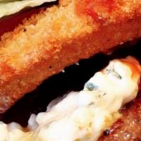 Black & Blue Burger · A blackened, 1/2-lb burger topped with premium blue cheese & breaded onion ring. Delicious. ...