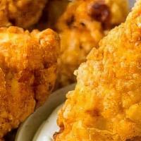 Chicken Strips · A tender, all-white-meat chicken coated in our unique breading & fried golden. Served with y...