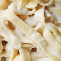 Pasta Alfredo · Tender pasta tossed in a creamy Alfredo sauce. Add Chicken for $4. Served with a House Salad.