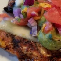 Southwest Chicken Dinner · Grilled chicken topped with melted pepper Jack cheese, guacamole & pico de gallo. Served wit...