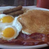 The Soleil Combo Breakfast · Two eggs with two bacon, two links of sausage, and two golden plain French crepes. Served wi...