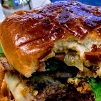 Chipotle Burger · A juicy burger with onion strings topped melted jalapeño, Jack cheese and zesty chipotle may...