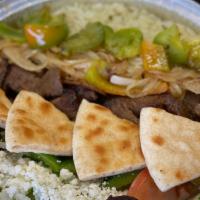 Traditional Gyro Bowl · Lamb and beef gyro slices, lettuce, tomato, onion, green pepper and feta cheese served over ...