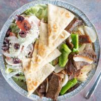 Chicken Gyro Bowl · Chicken, lettuce, tomato, onion, green pepper, and feta cheese served over basmati rice with...