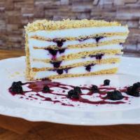 Honey Cake · Honey layers with sour cream and homemade jam. Topped with walnuts.