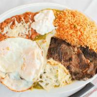 Chilaquiles · Chips smothered with egg and sauce. / Chilaquiles con salsa y huevo.