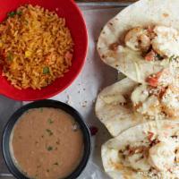 Blackened Shrimp Taco · Grilled shrimp with cotija cheese, pico de gallo and orange aioli. 3 tacos served in flour t...