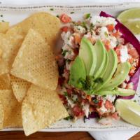 Ceviche · Shrimp and tilapia marinated in lime and lemon juice with tomatoes, onions and cilantro.