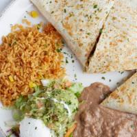 Fajita Quesadilla · Famous. Stuffed with your choice of tender steak or chicken, onions, red, and green bell pep...