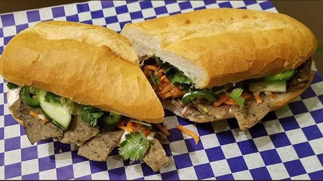 Hoisin Pulled Pork · Served on a French-Vietnamese baguette with pickled carrots, cucumbers, jalapenos and cilantro.