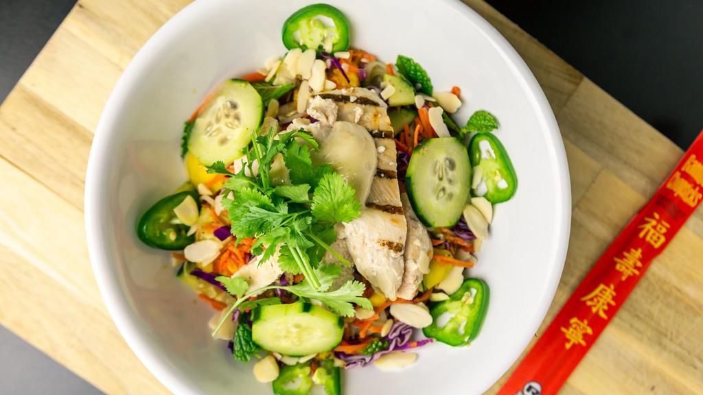 Ginger Chicken (Most Popular Noodle Bowl) · Rice noodles with lime-cilantro-jalapeno-mint dressing with pickled carrots, cucumbers, cilantro, jalapenos, mango and red cabbage.