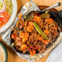 Fajitas · Sautéed onions, bell peppers, tomatoes + poblanos, with rice, beans, sour cream, pico de gal...