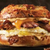 Texas Brisket Sandwich · Cage-free fresh-cracked eggs, smoked beef brisket, cheddar with smoky chipotle aioli  on a n...