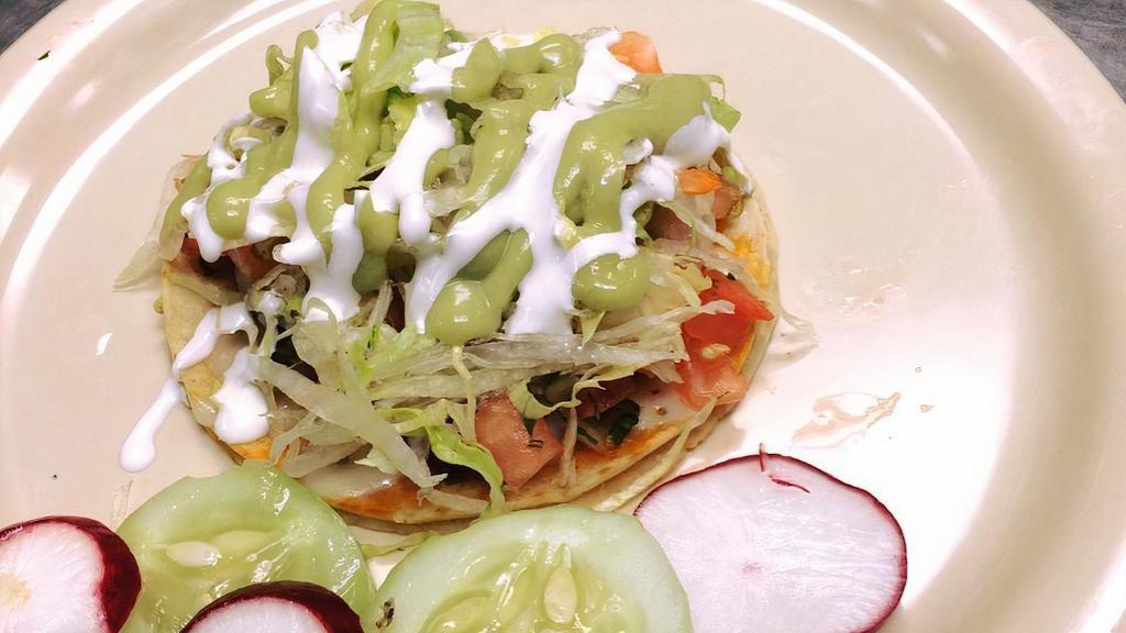Grilled Fish Taco · Grill fish with shredded lettuce, pico de gallo, drizzle with avocado salsa on soft grill flour tortilla.