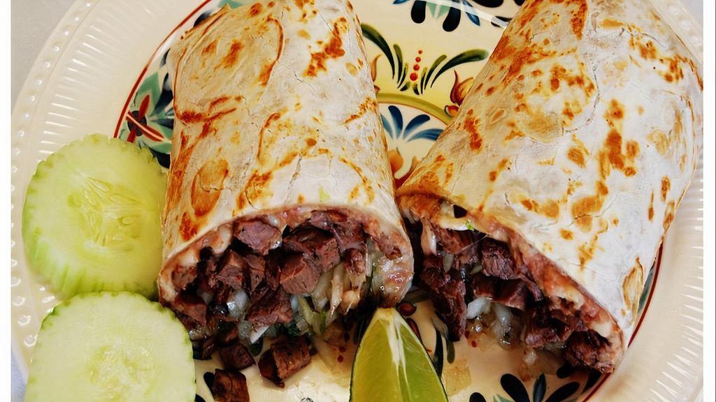 El Favorito ( Everybody'S Favorite ) · Choice of your favorite meat with melted cheese, refried beans, onions and cilantro all rolled up in a warm soft flour tortilla. * 
 
*Everybody's Favorite!