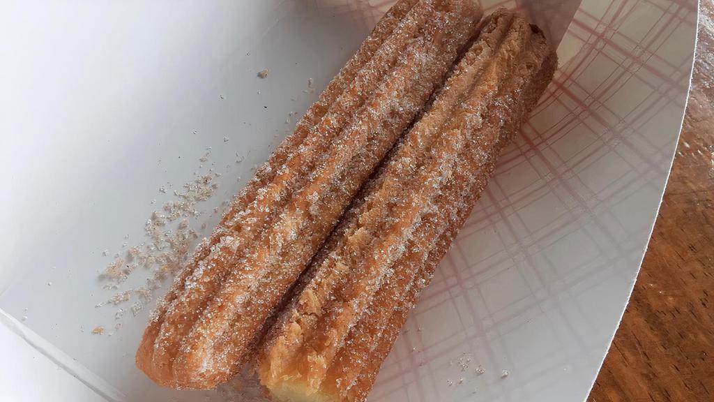 Churros · a sweet consisting of a strip of fried dough dusted with sugar and  cinnamon.