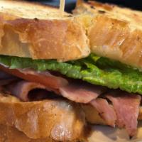 Big Jim Sandwich · Grilled Dearborn ham, melted Swiss cheese, lettuce, tomato, and mayo served on grilled chall...