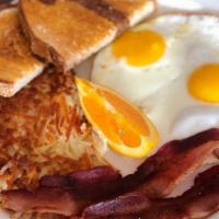 Traditional Breakfast · Two eggs, choice of meat, hash browns and toast.