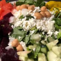 Greek Salad · Gluten free. Chopped romaine lettuce, feta cheese, fresh roasted beets, sweet onions, garban...