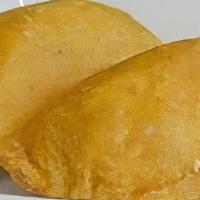 Empanadas · Traditional turnovers in a crunchy corn ﬂour shell stuﬀed with beef or chicken. Vegetarian (...