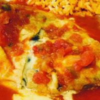 Chile Relleno · Poblano pepper stuffed with cheese, butter dipped, and deep fried, served with beans, rice, ...